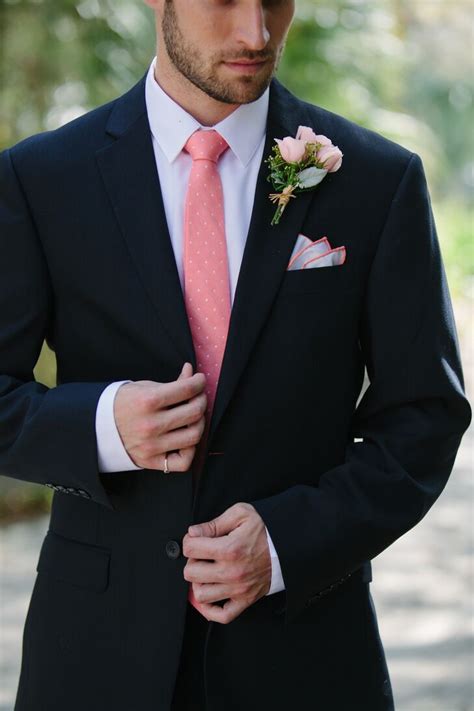 navy blue suit with pink tie